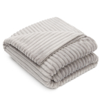 Blanket „Ancient fleece blanket“. Blankets, 200x220 cm. Soft grey microfiber throw “ancient” on a sofa.