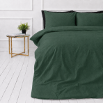 Linen bedding set „Linen Dark Green“. Bedding sets 150x200, 140x200 cm, 150x200 cm, 160x200 cm, 180x200 cm, 200x200 cm, 200x220 cm, 220x240 cm. Dark green linen bedding set on a white floor with a bedside table and a flower pot. Linen bedding set „Linen Dark Green“. Bedding sets 150x200, 140x200 cm, 150x200 cm, 160x200 cm, 180x200 cm, 200x200 cm, 200x220 cm, 220x240 cm. Dark green linen bedding set on a white floor with a bedside table and a flower pot.