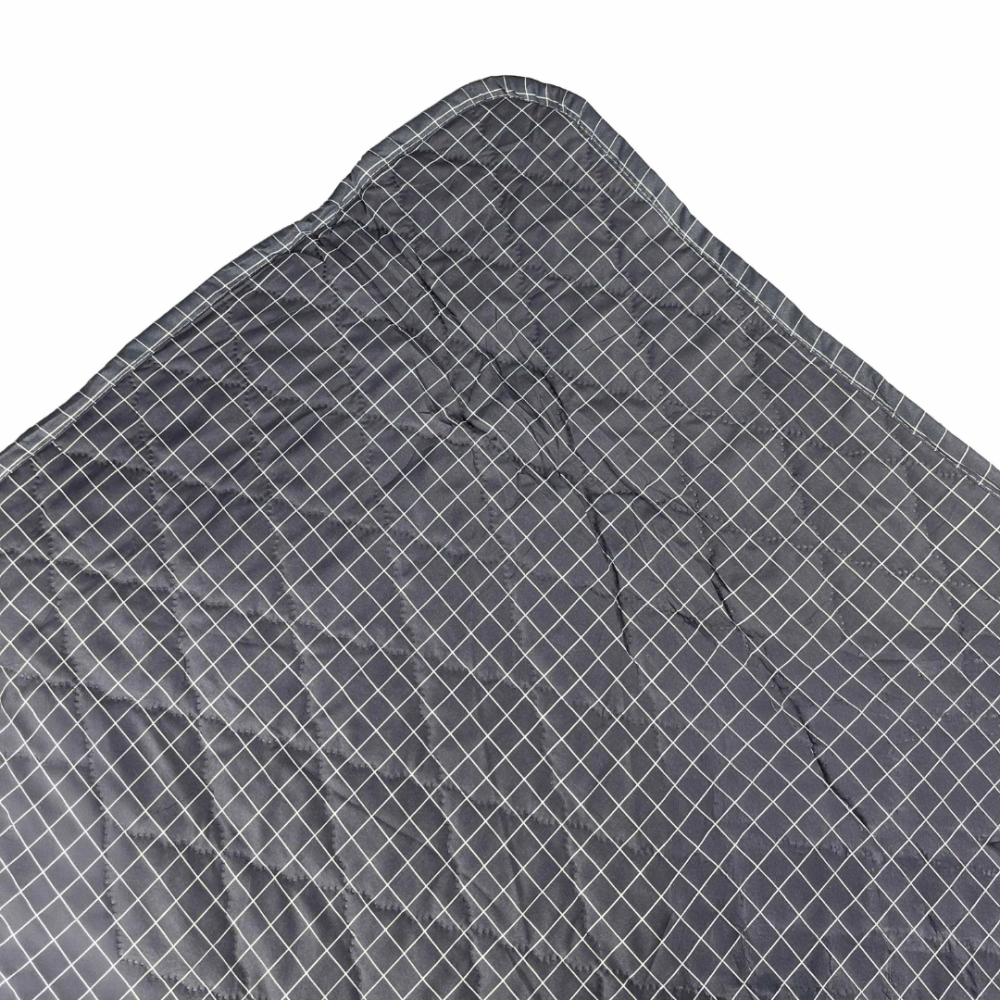 Bedspread “Timeless Lines”. Blankets, 195x225 cm. Elegant dark gray bedspread with a fine white line pattern, spread out to showcase its soft, quilted texture.