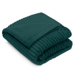 Plaid „Emerald fleece blanket“. Blankets, 200x220 cm. Dark emerald green fleece throw “emerald” spread out on a bed.