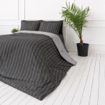 Sateen Bedding Set „Tones“. Mako cotton sateen bedding, 140x200 cm, 200x200 cm, 200x220 cm. Elegant dark grey bedding with vertical lines, accented in shades of grey, white, and subtle orange Sateen Bedding Set „Tones“. Mako cotton sateen bedding, 140x200 cm, 200x200 cm, 200x220 cm. Elegant dark grey bedding with vertical lines, accented in shades of grey, white, and subtle orange