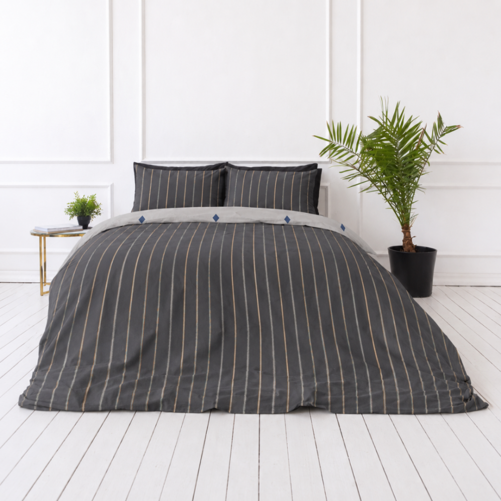Sateen Bedding Set „Tones“. Mako cotton sateen bedding, 140x200 cm, 200x200 cm, 200x220 cm. Contemporary bedding in dark grey, showcasing chic vertical lines in grey, white, and hints of orange Sateen Bedding Set „Tones“. Mako cotton sateen bedding, 140x200 cm, 200x200 cm, 200x220 cm. Contemporary bedding in dark grey, showcasing chic vertical lines in grey, white, and hints of orange