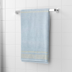Bath towel “Glacier Olympian”, 70x140 cm. Pastel blue towel with a greek golden ornament pattern at the bottom.