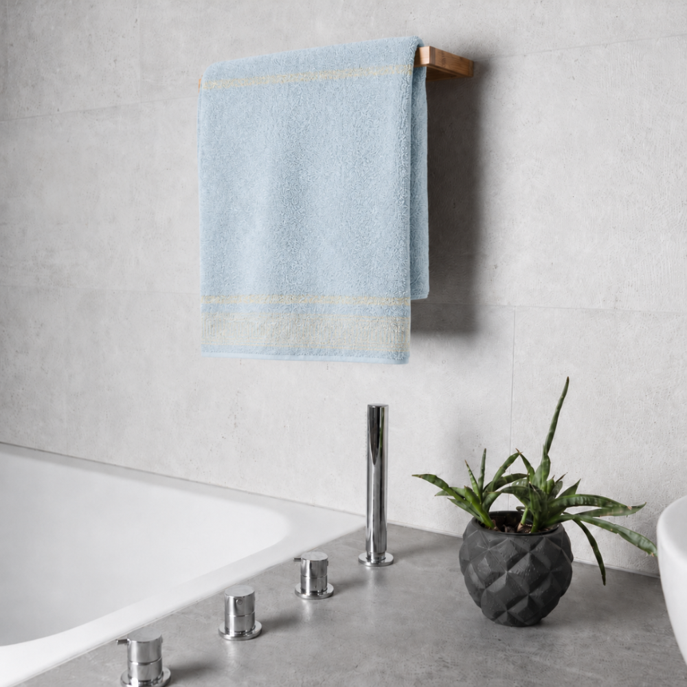 Bath towel “Glacier Olympian”, 70x140 cm. Pastel blue towel with a greek golden ornament pattern at the bottom. Bath towel “Glacier Olympian”, 70x140 cm. Pastel blue towel with a greek golden ornament pattern at the bottom.