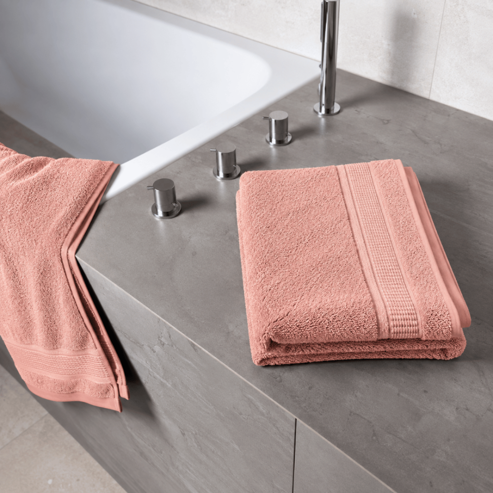 Bath towel “Royal Coral towel”, 70x140 cm. Pastel pink bath towel with a textured surface and decorative edging. Bath towel “Royal Coral towel”, 70x140 cm. Pastel pink bath towel with a textured surface and decorative edging.