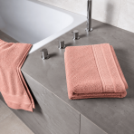 Bath towel “Royal Coral towel”, 70x140 cm. Pastel pink bath towel with a textured surface and decorative edging. Bath towel “Royal Coral towel”, 70x140 cm. Pastel pink bath towel with a textured surface and decorative edging.