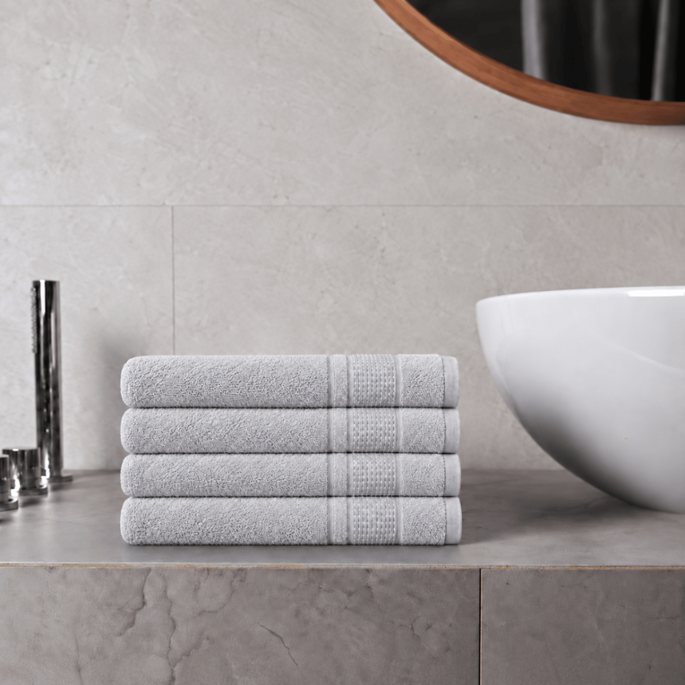 Bath towel “Royal Light Grey towel”, 70x140 cm. Solid grey towel with a fine geometric pattern in the border.