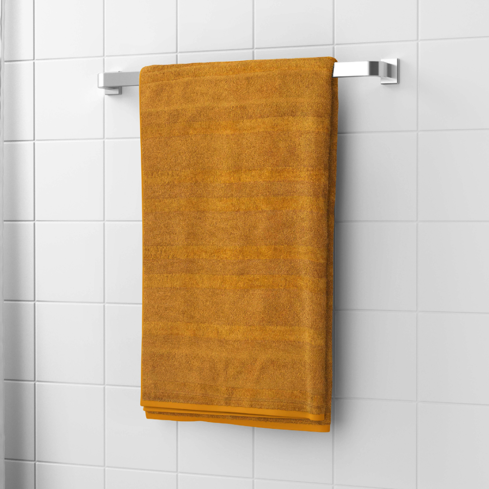 Bath towel “Terry Mustard”, 50x90 cm, 70x140 cm. Luxurious mustard cotton bath towel, plush and durable, offering a cozy and elegant experience for your daily bath routine.