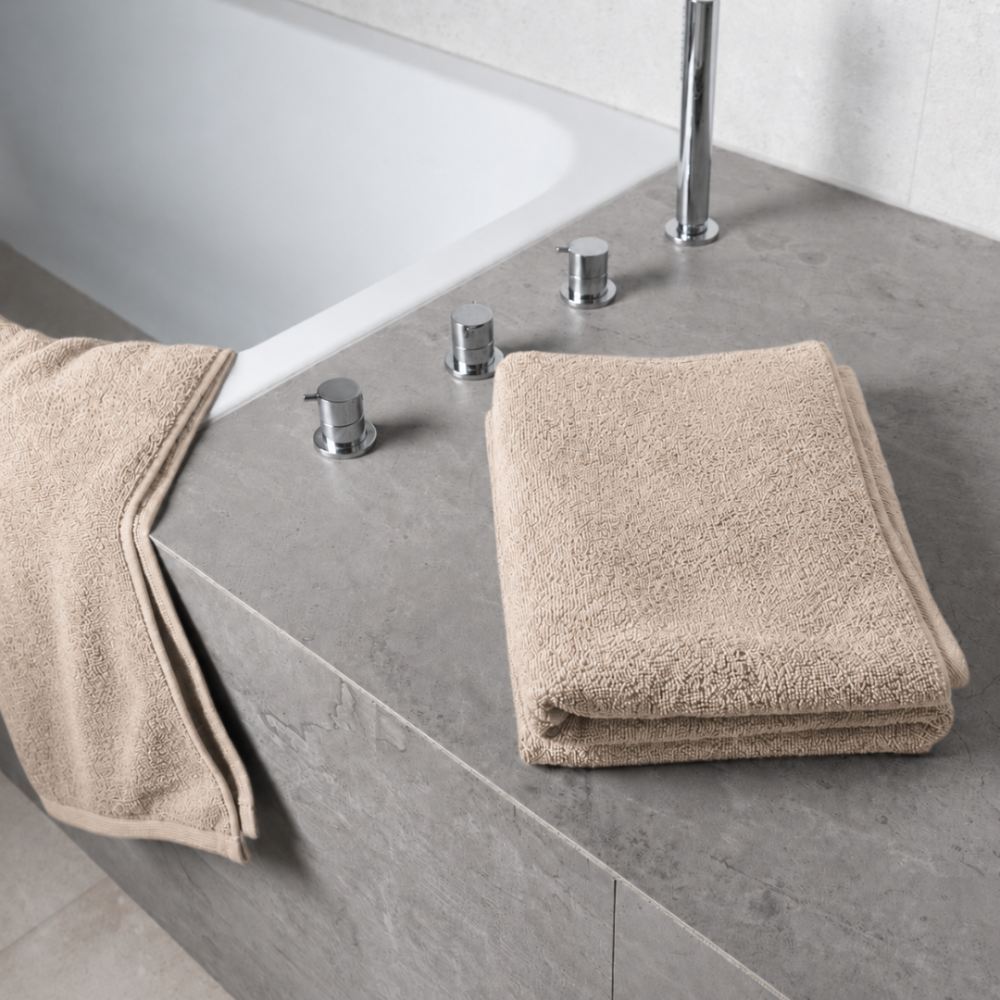 Bath towel “Toffee towel”, 50x100 cm, 70x140 cm. Folded towel in a creamy sand beige shade Bath towel “Toffee towel”, 50x100 cm, 70x140 cm. Folded towel in a creamy sand beige shade